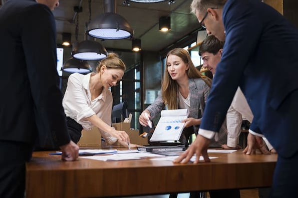 Management figuring out how to structure a marketing team