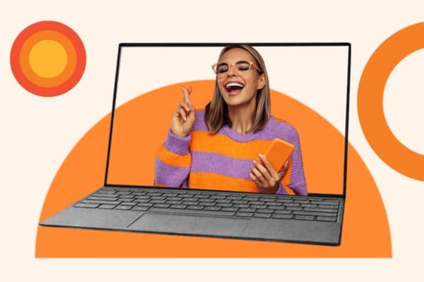A woman smiles in a promotional video displayed on a laptop